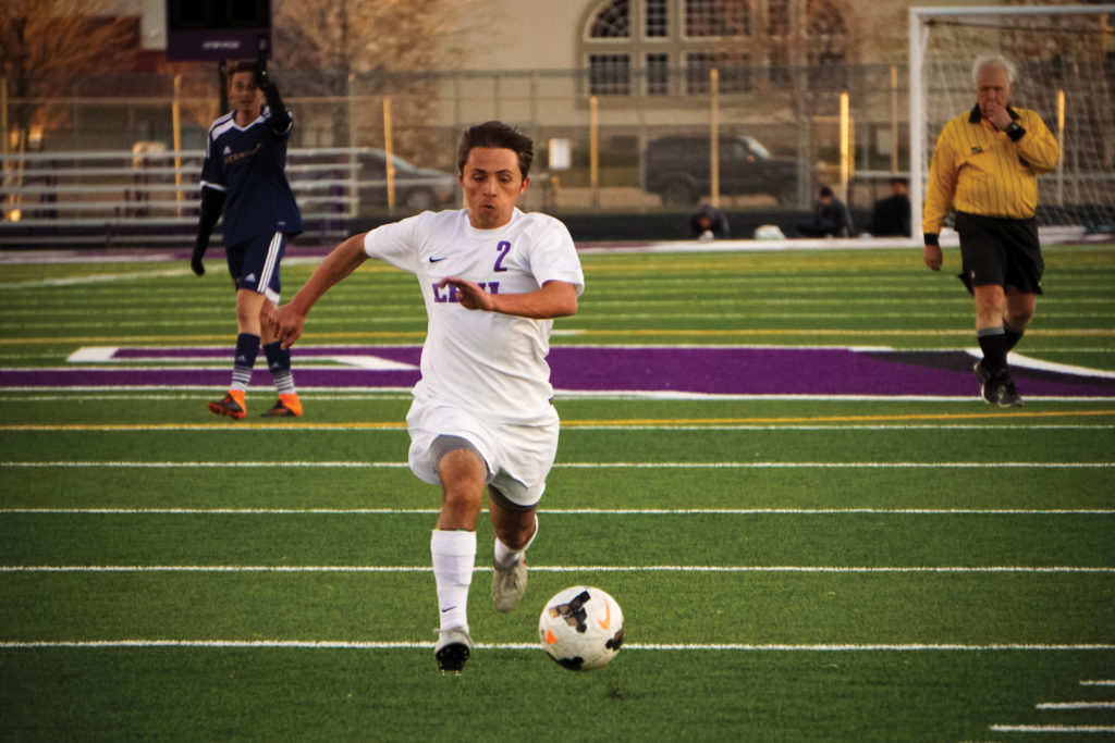 LHS soccer player Jaxon Sorensen dribbles down the turf in a recent match. Photo credit: Riley Livingston
