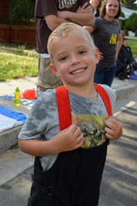 Emil Kunze was happy to get soaked with a water gun by one of the firefighters in the parade. Photo: Nicole Kunze