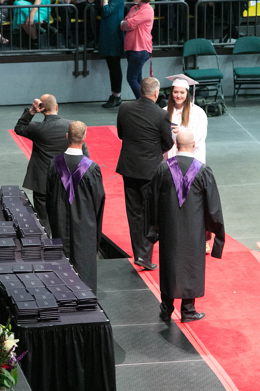 Heather Nielsen receives her diploma from Scott Carlson. Photo: Kaye Collins
