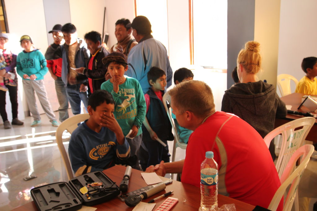 Dr. Pickering examines patients on his humanitarian mission to Peru.